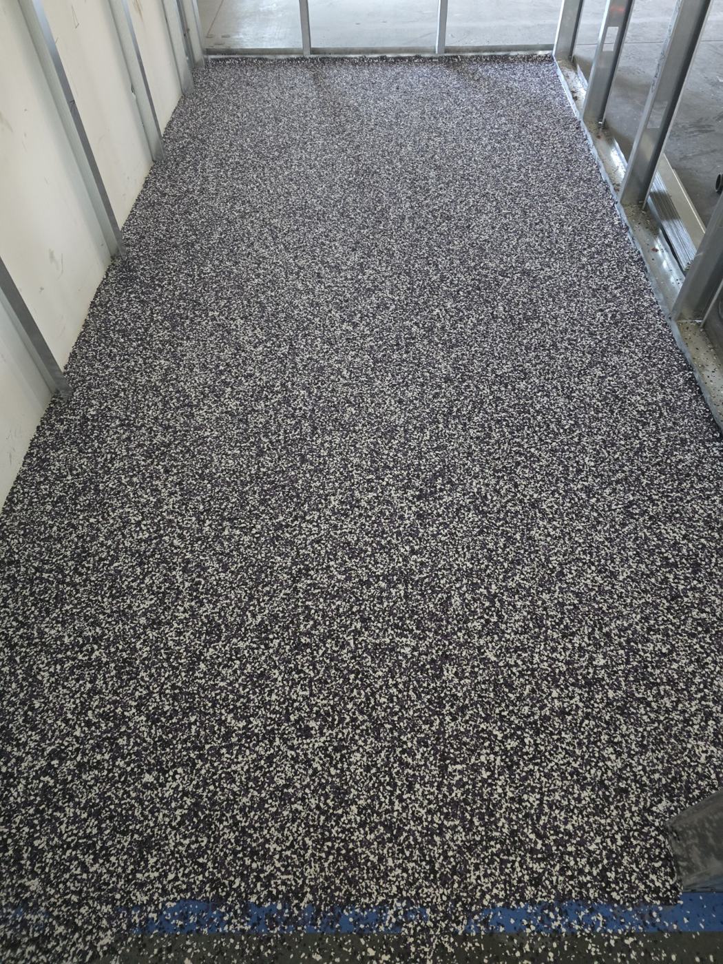 decorative flake floor installed by Acclaim Specialty Coatings, serving Highlands Ranch, Colorado