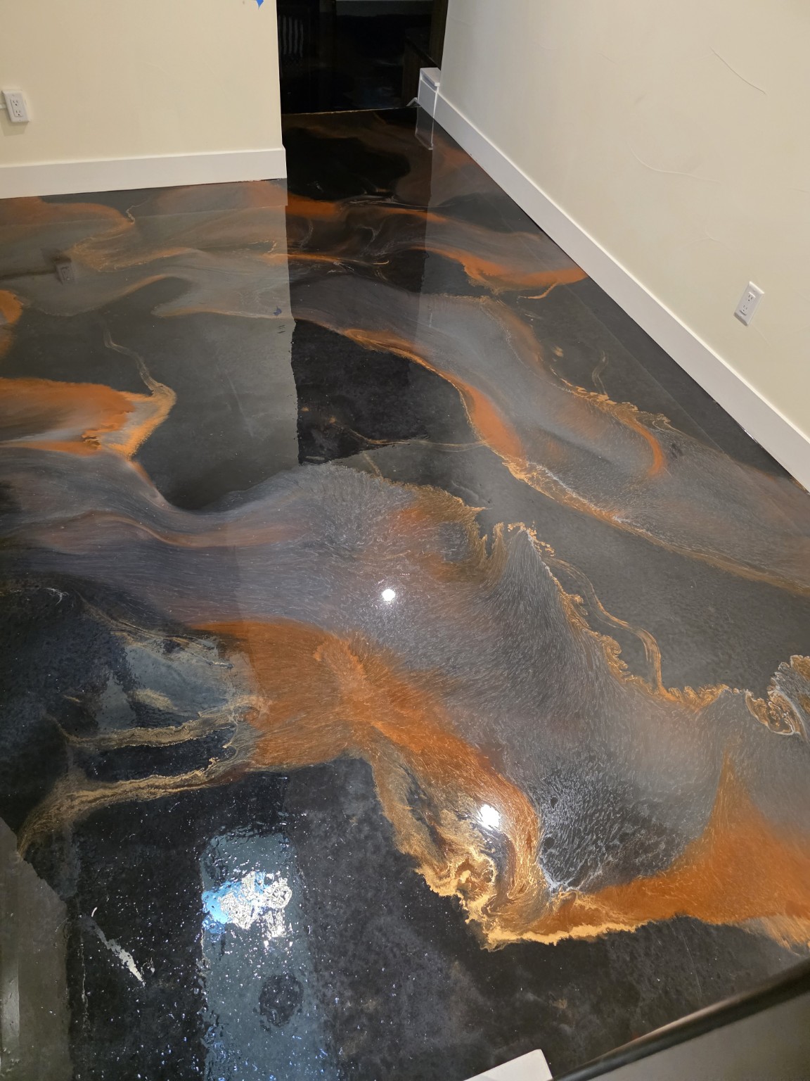metallic epoxy floor installed by Acclaim Specialty Coatings, serving Highlands Ranch, Colorado
